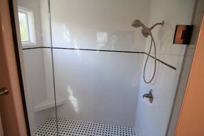 Bathtub, eco-friendly toiletries, hair dryer, towels