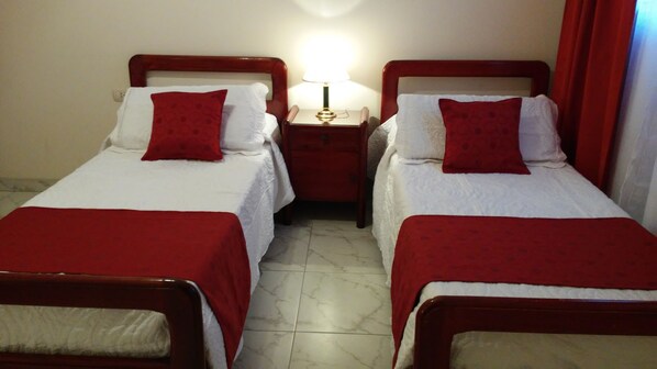 2 bedrooms, blackout curtains, iron/ironing board, rollaway beds