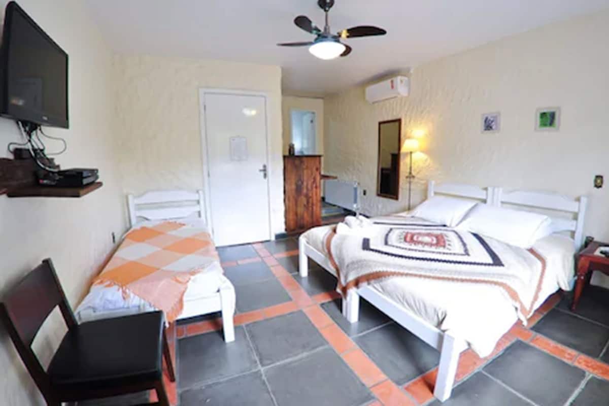 Triple Room | Minibar, desk, blackout curtains, free WiFi