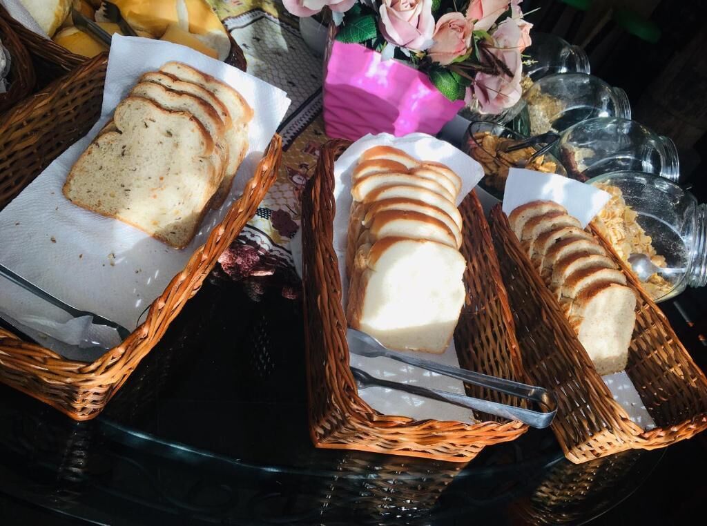 A buffet table with bread and butter.