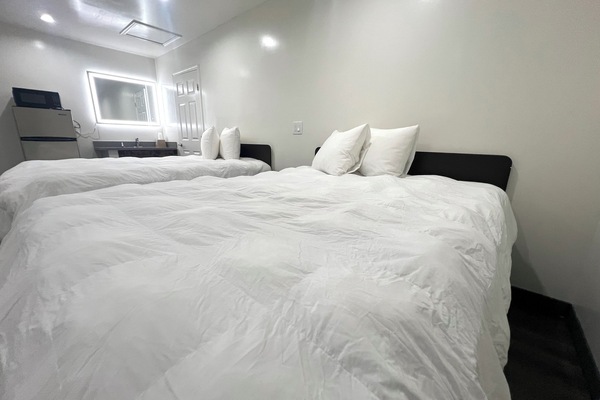 Deluxe Room, 2 Queen Beds, Non Smoking | Iron/ironing board (on request), bed sheets