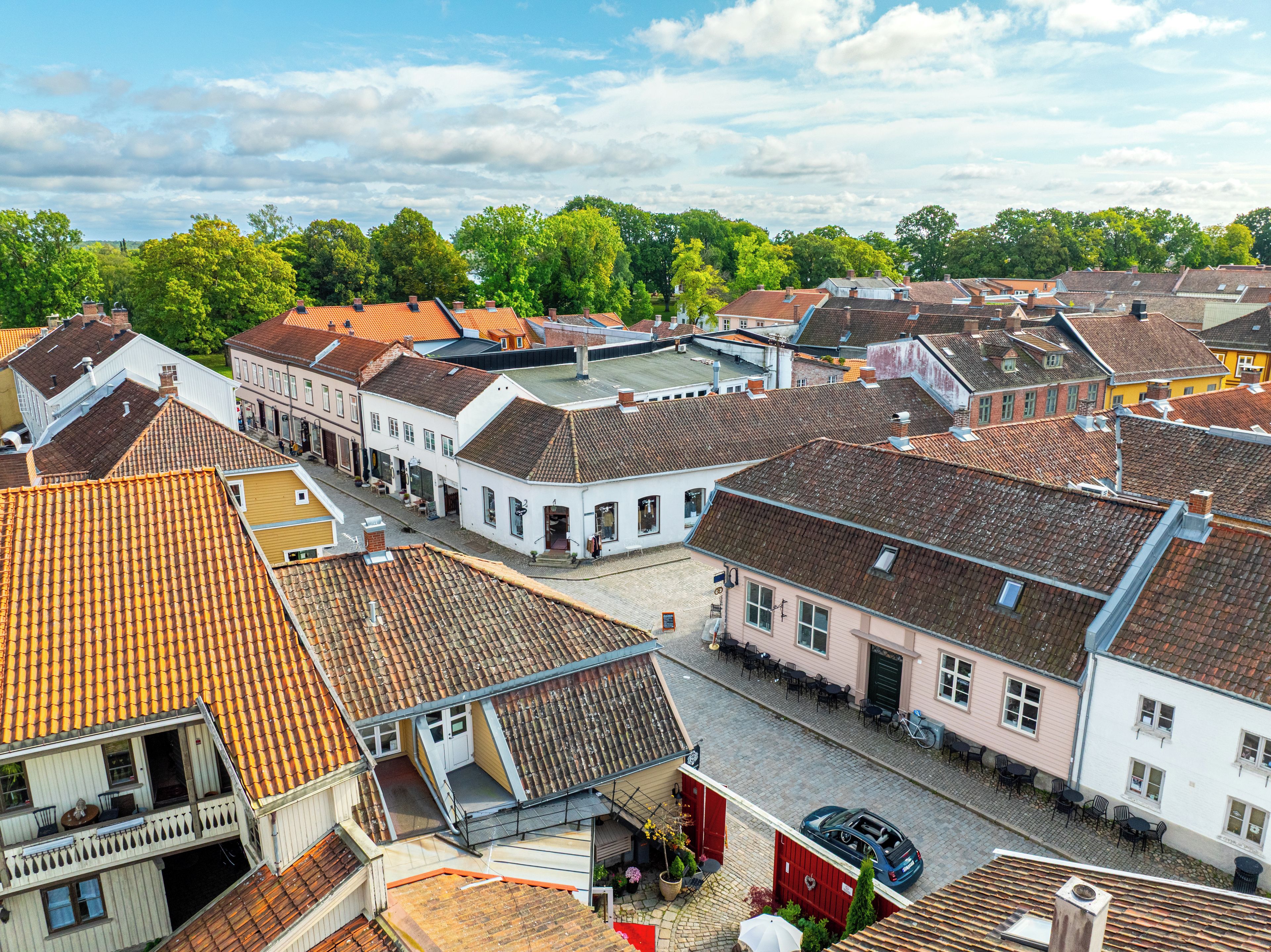 A European town with traditional architecture, cobblestone streets, and a mix of residential and commercial buildings.