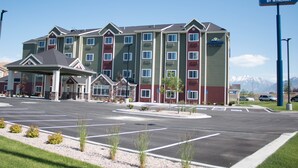 A Microtel Inn & Suites building with a parking lot in front.