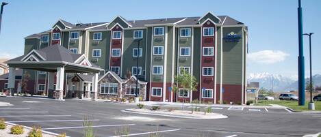 A Microtel Inn & Suites building with a parking lot in front.