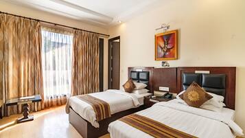 Deluxe Double or Twin Room | Minibar, in-room safe, desk, soundproofing