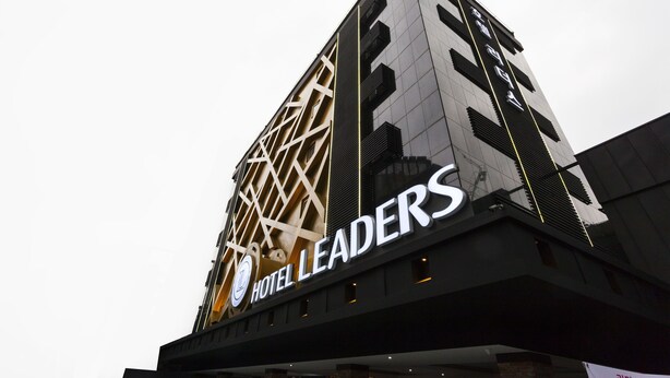 A hotel building with a prominent sign reading "HOTEL LEADERS". - Hotel Leaders (Seoul)