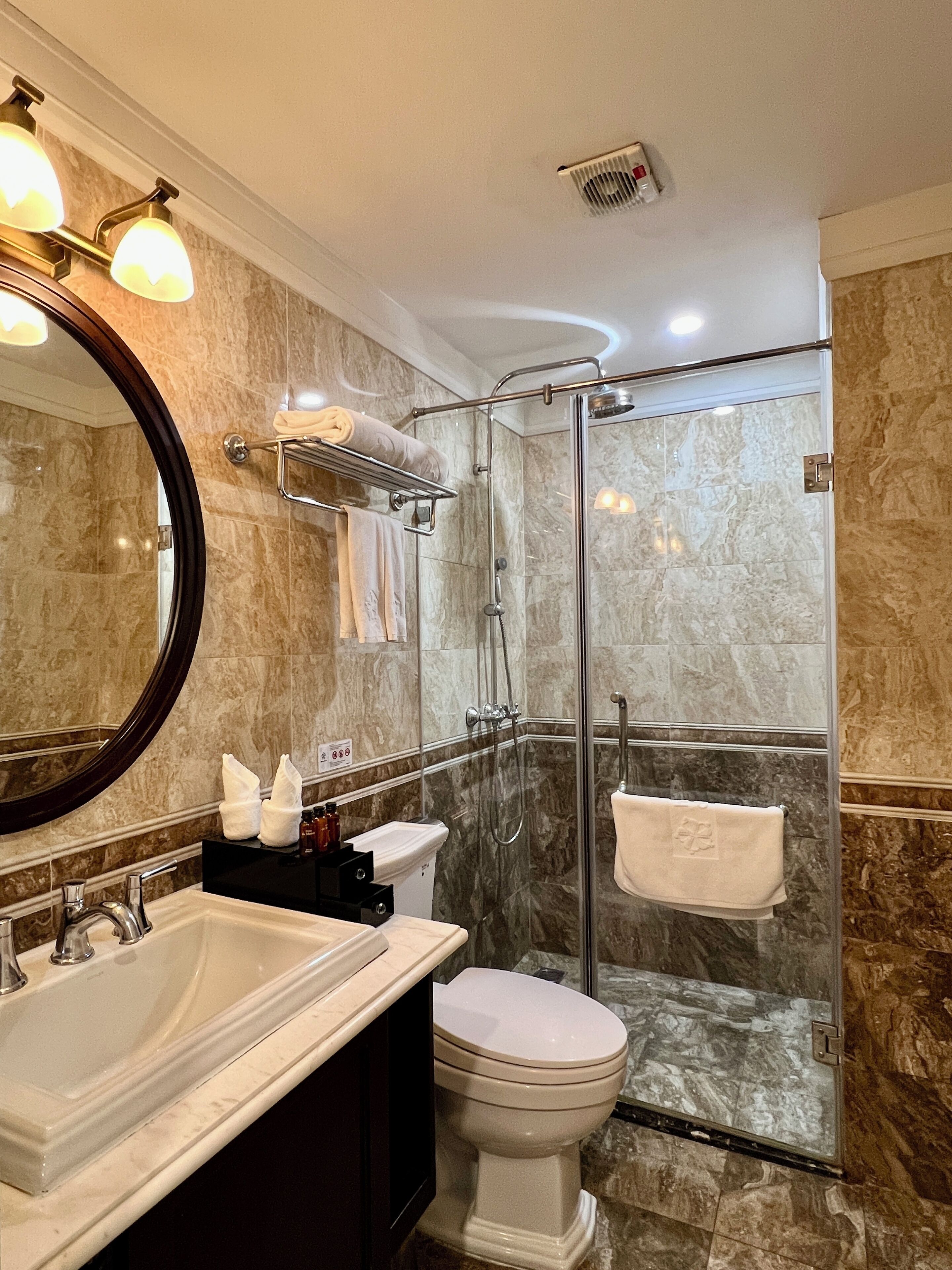deluxe room, city view | bathroom | hydromassage showerhead, designer toiletries, hair dryer, bathrobes