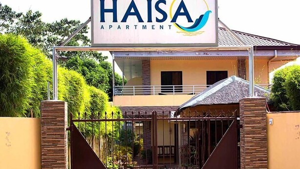 A gated entrance to a residential building with a sign reading "HAISA APARTMENT". - Haisa Apartment (Coron)