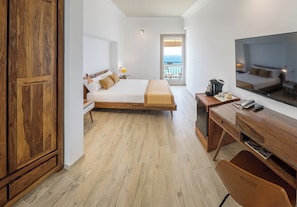 Deluxe Triple Room, Sea View | Premium bedding, minibar, in-room safe, desk