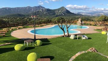 Seasonal outdoor pool, open 10:00 AM to 6:00 PM, pool umbrellas