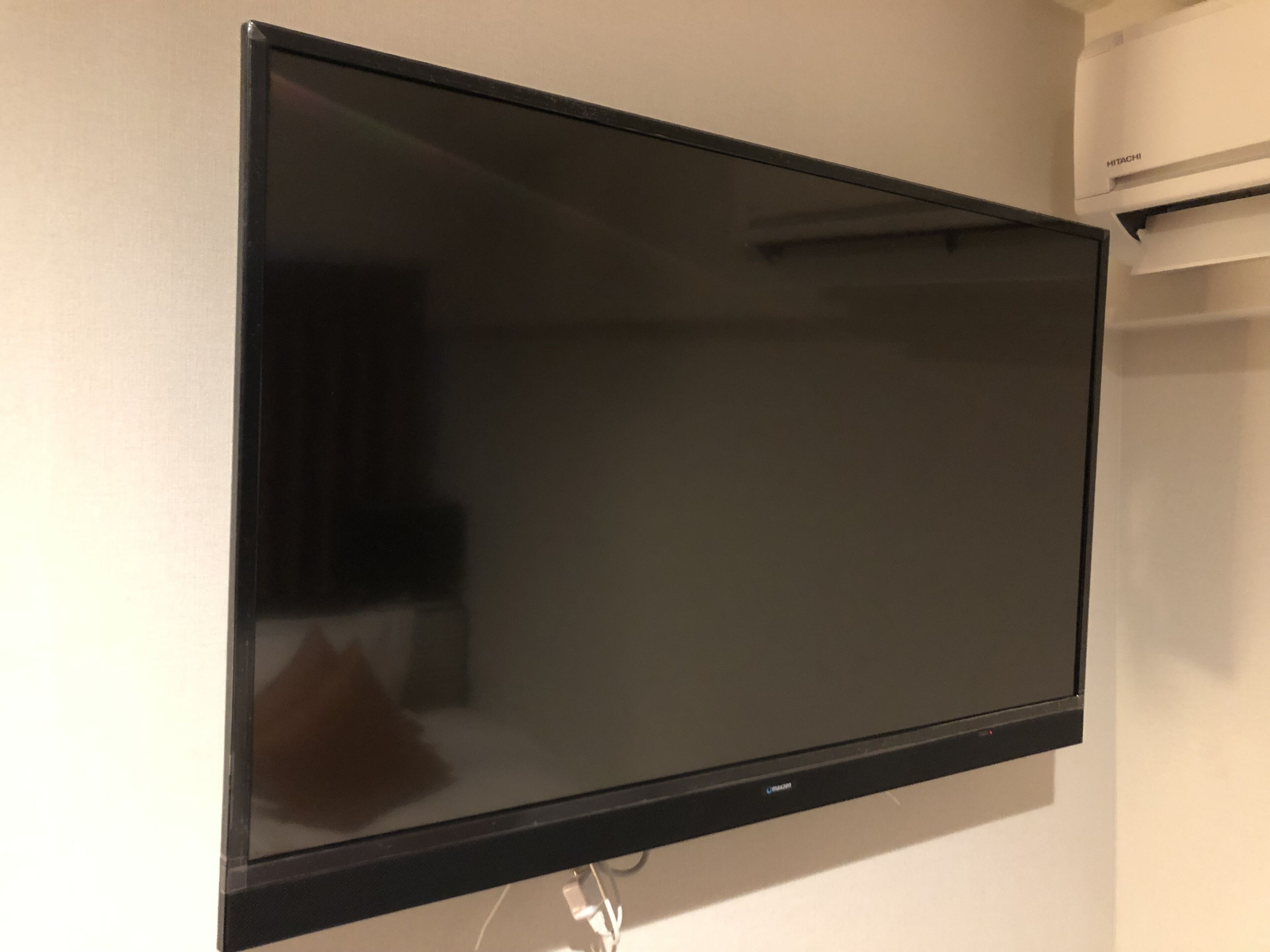 A flat-screen TV mounted on a wall.