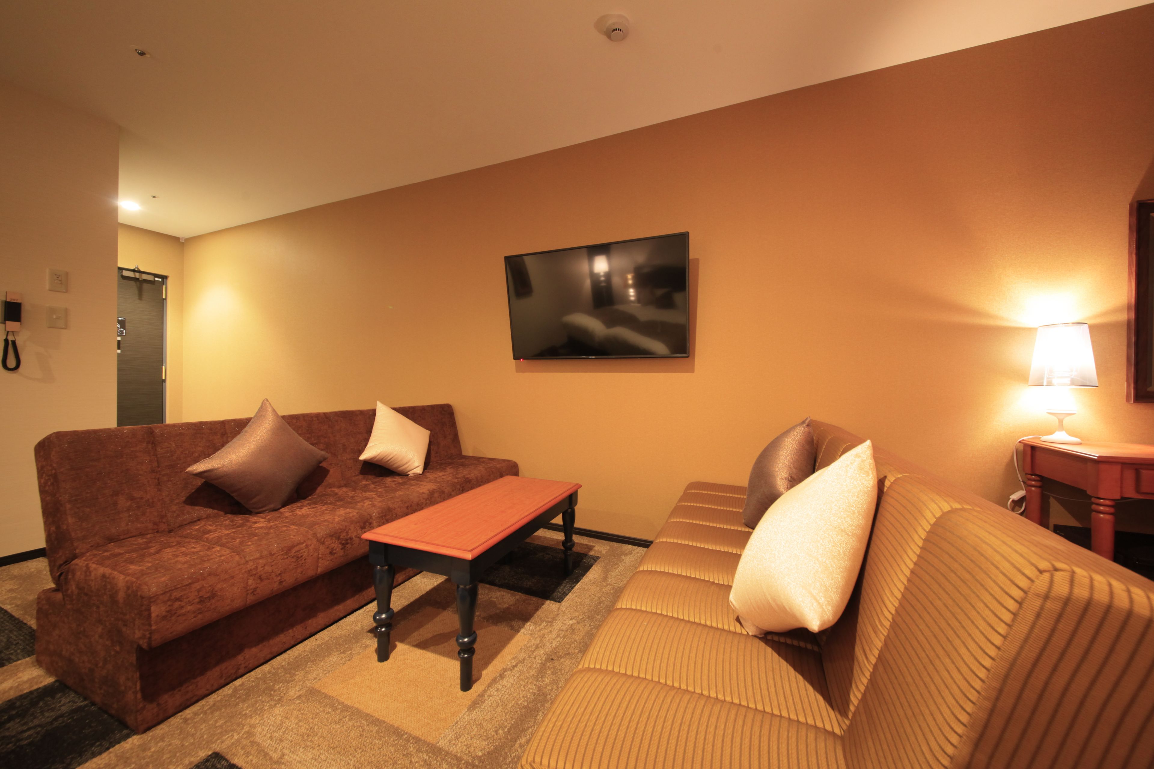 comfort twin room, non smoking - extra sofa bed is from 5th adult | living area | flat-screen tv