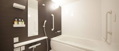 A modern bathroom with a bathtub, a shower, and a vanity with a mirror and shelves.