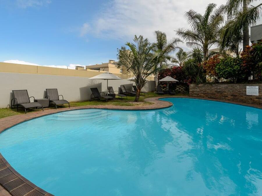 Outdoor pool, pool umbrellas, pool loungers