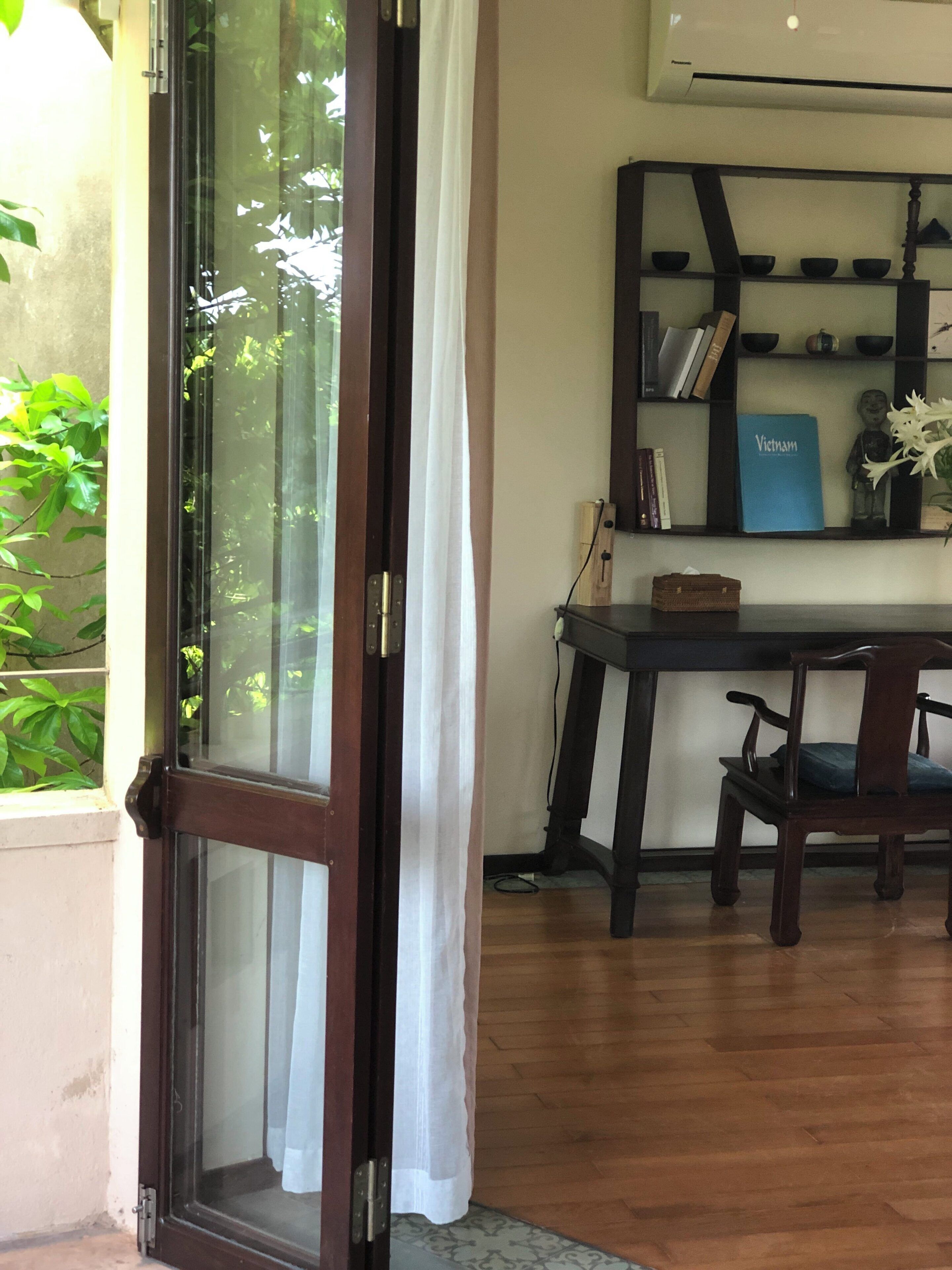 deluxe studio suite, terrace, garden view | minibar, in-room safe, laptop workspace, blackout curtains