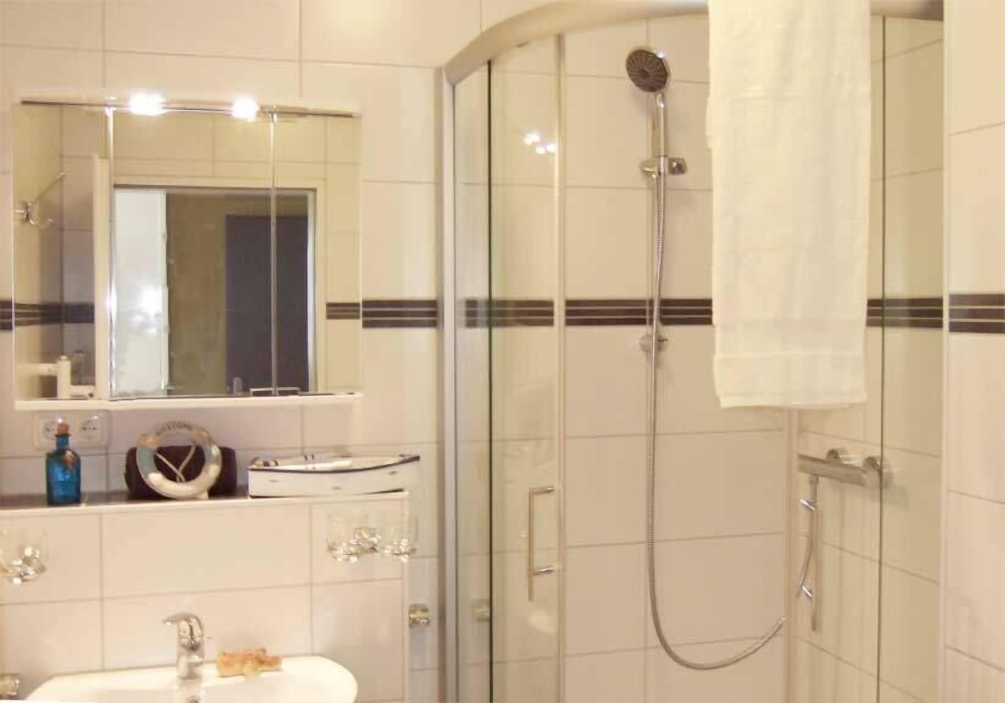 family apartment | bathroom | shower, hair dryer, towels, soap