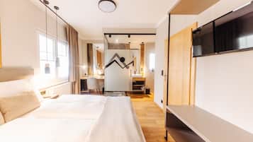 Deluxe Studio, 1 Bedroom, Garden Area | 1 bedroom, down comforters, in-room safe, individually decorated