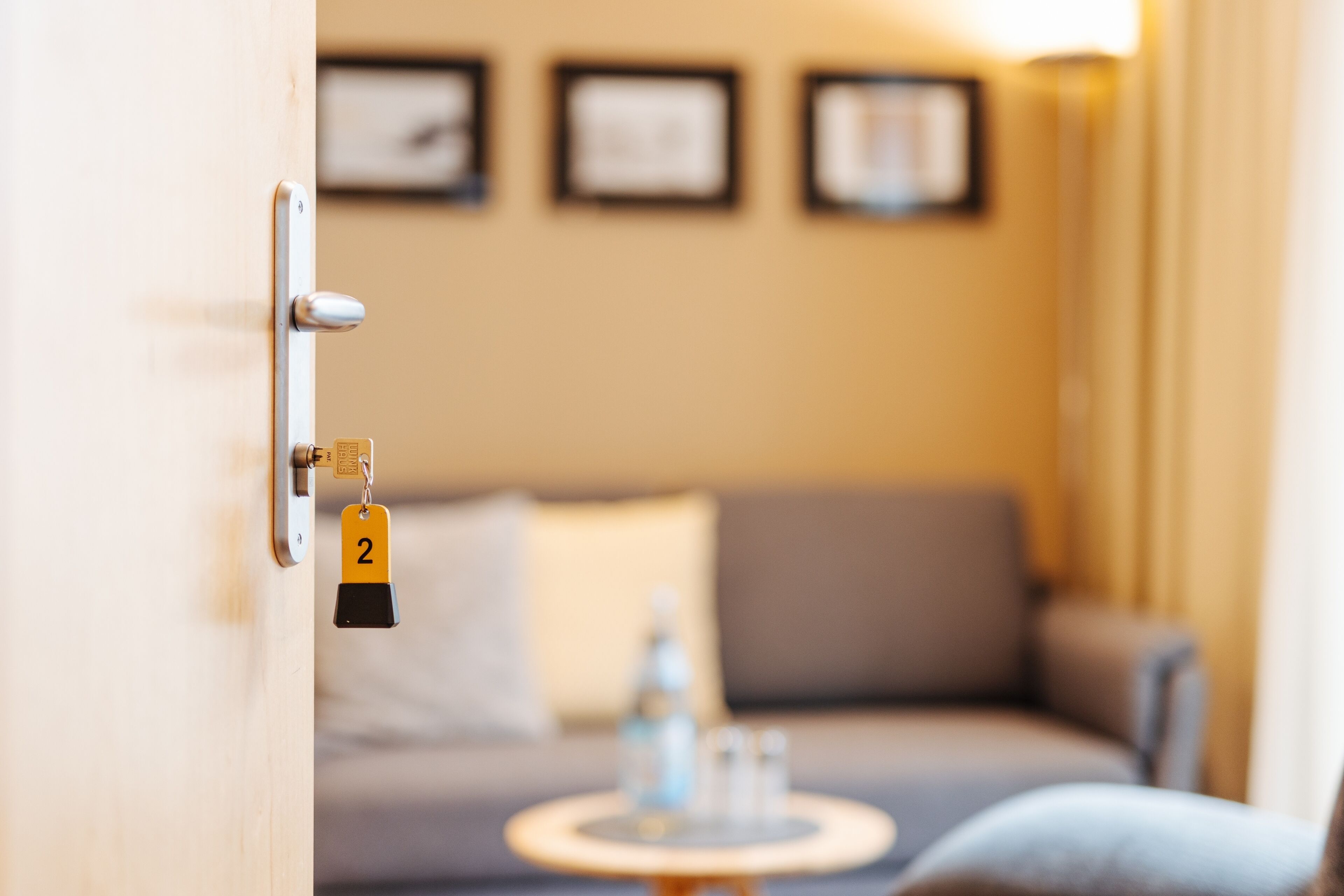 A door with a key lock and a number 2 keychain.