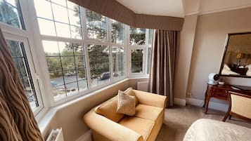 Family Double or Twin Room | Living room | Flat-screen TV