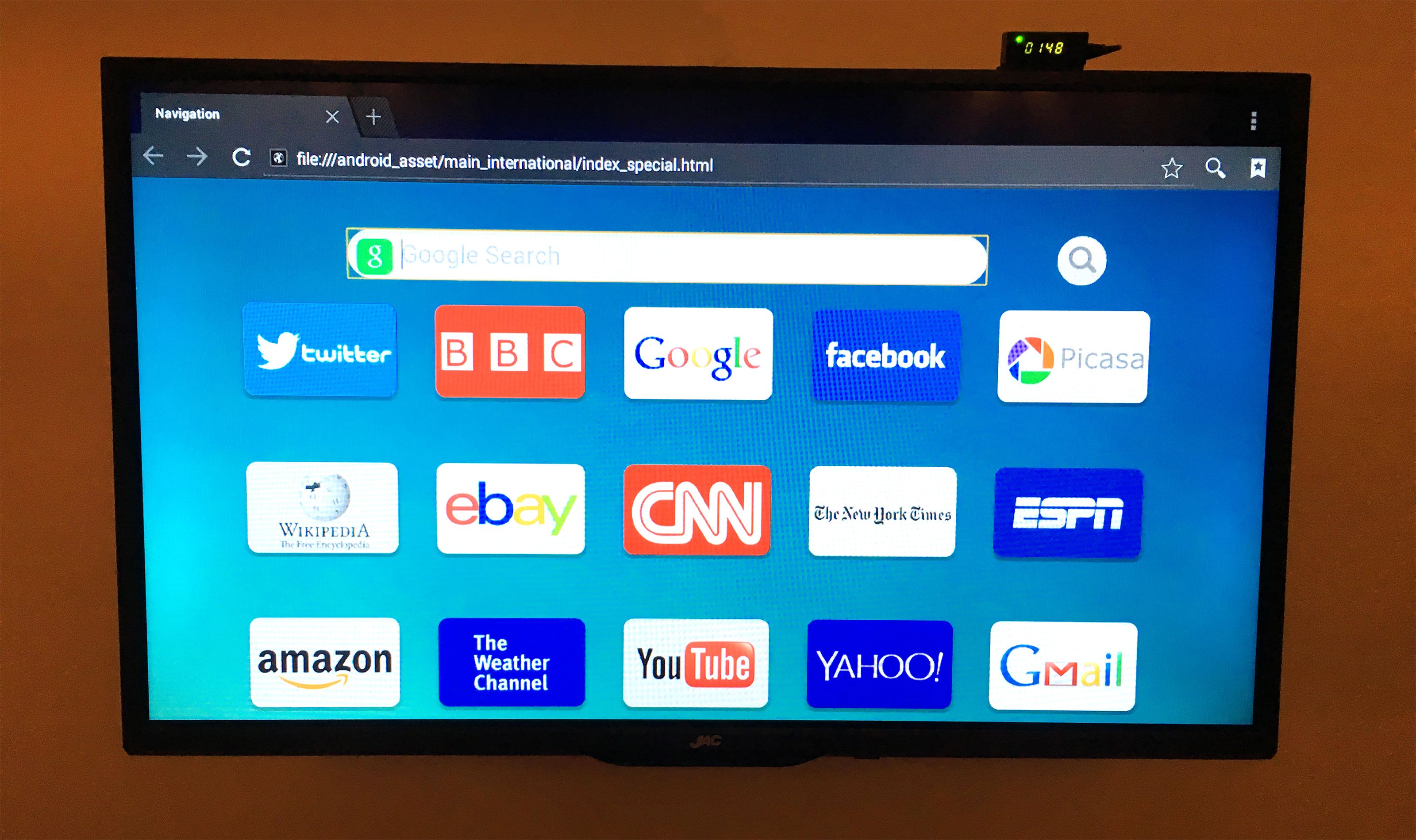 A computer monitor displaying a web browser with various website icons.