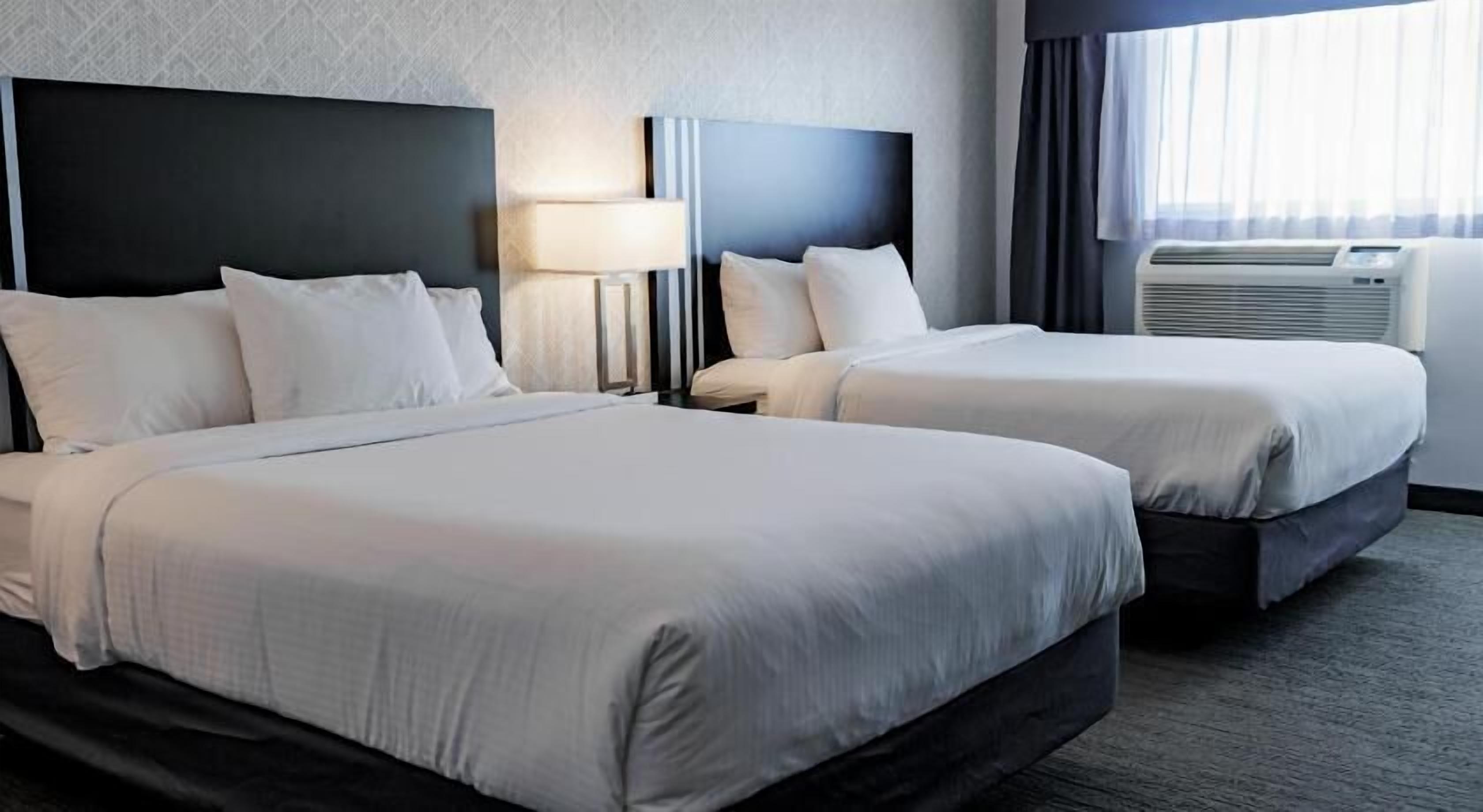 Premium bedding, desk, laptop workspace, soundproofing