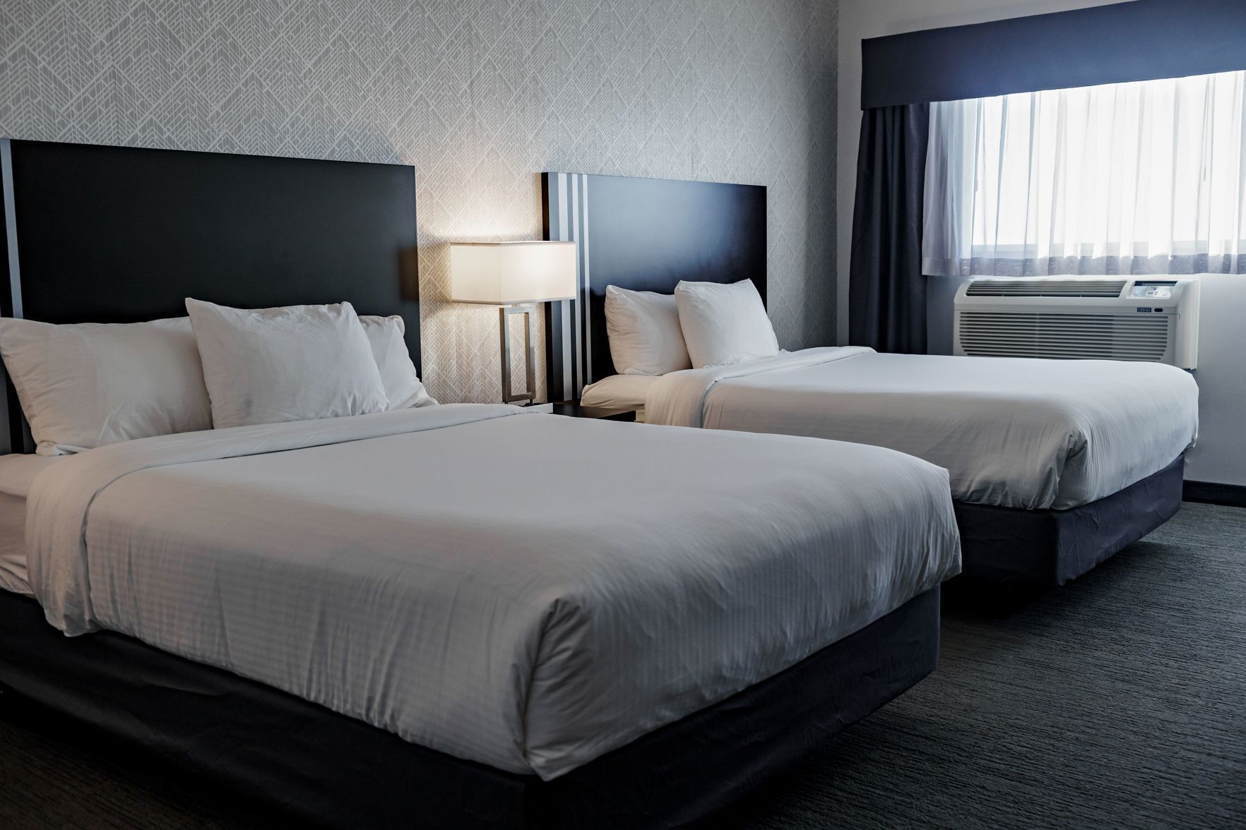 Premium bedding, desk, laptop workspace, soundproofing