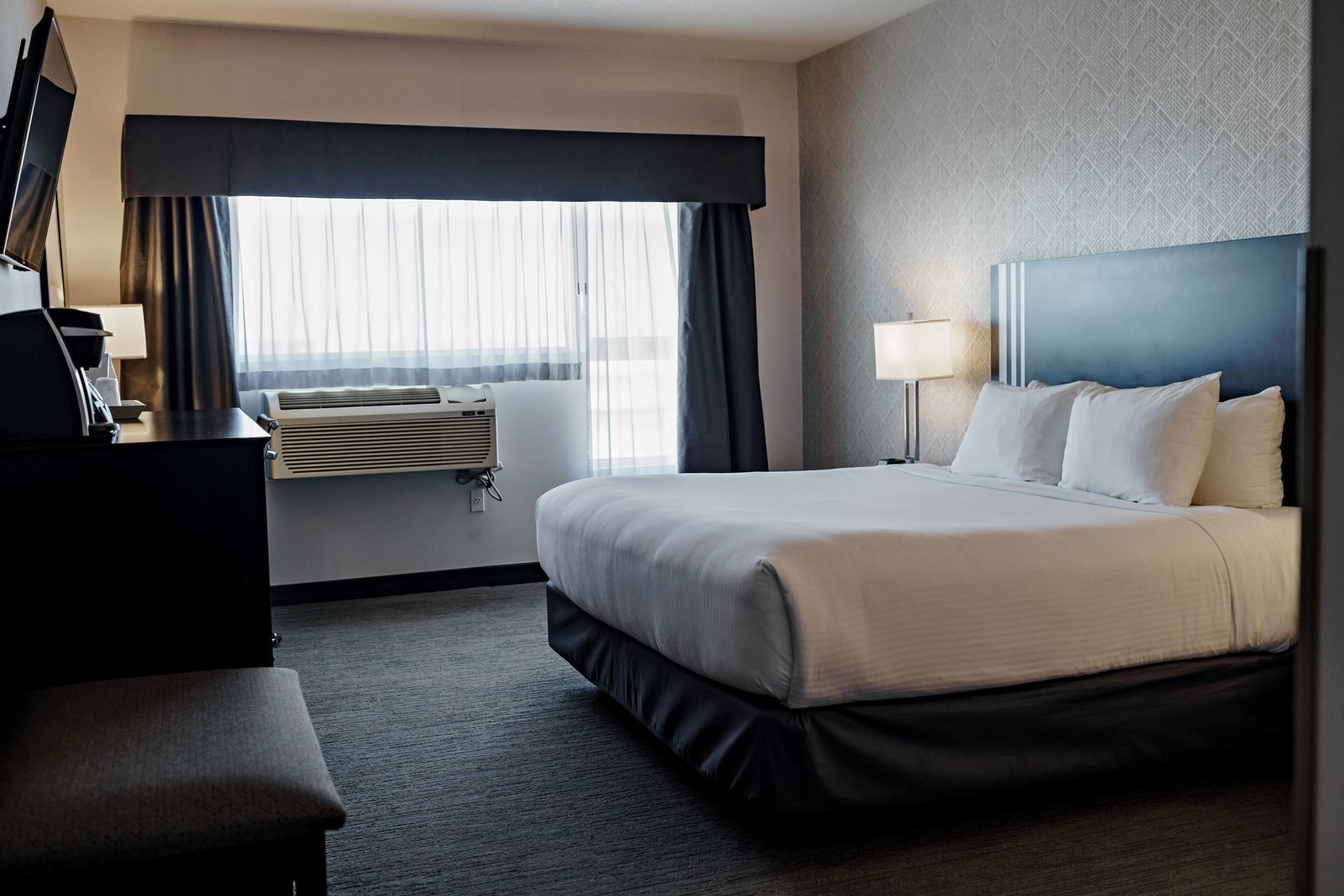 Premium bedding, desk, laptop workspace, soundproofing