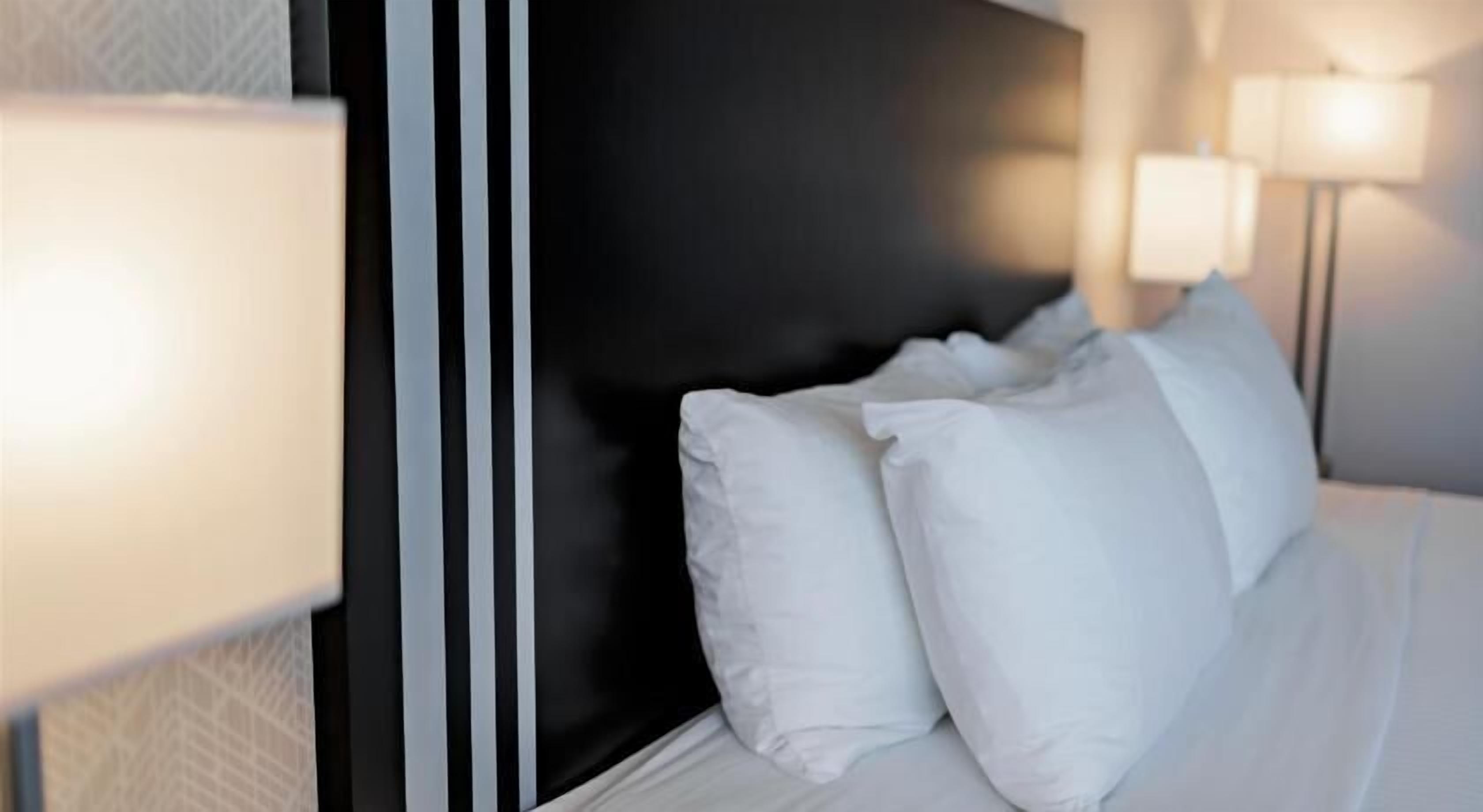 Premium bedding, desk, laptop workspace, soundproofing