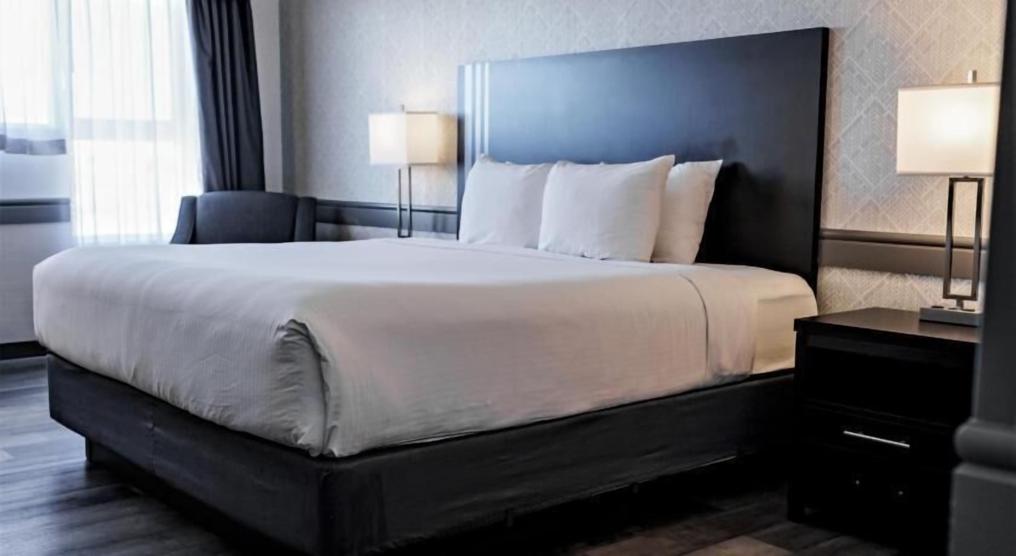 Premium bedding, desk, laptop workspace, soundproofing