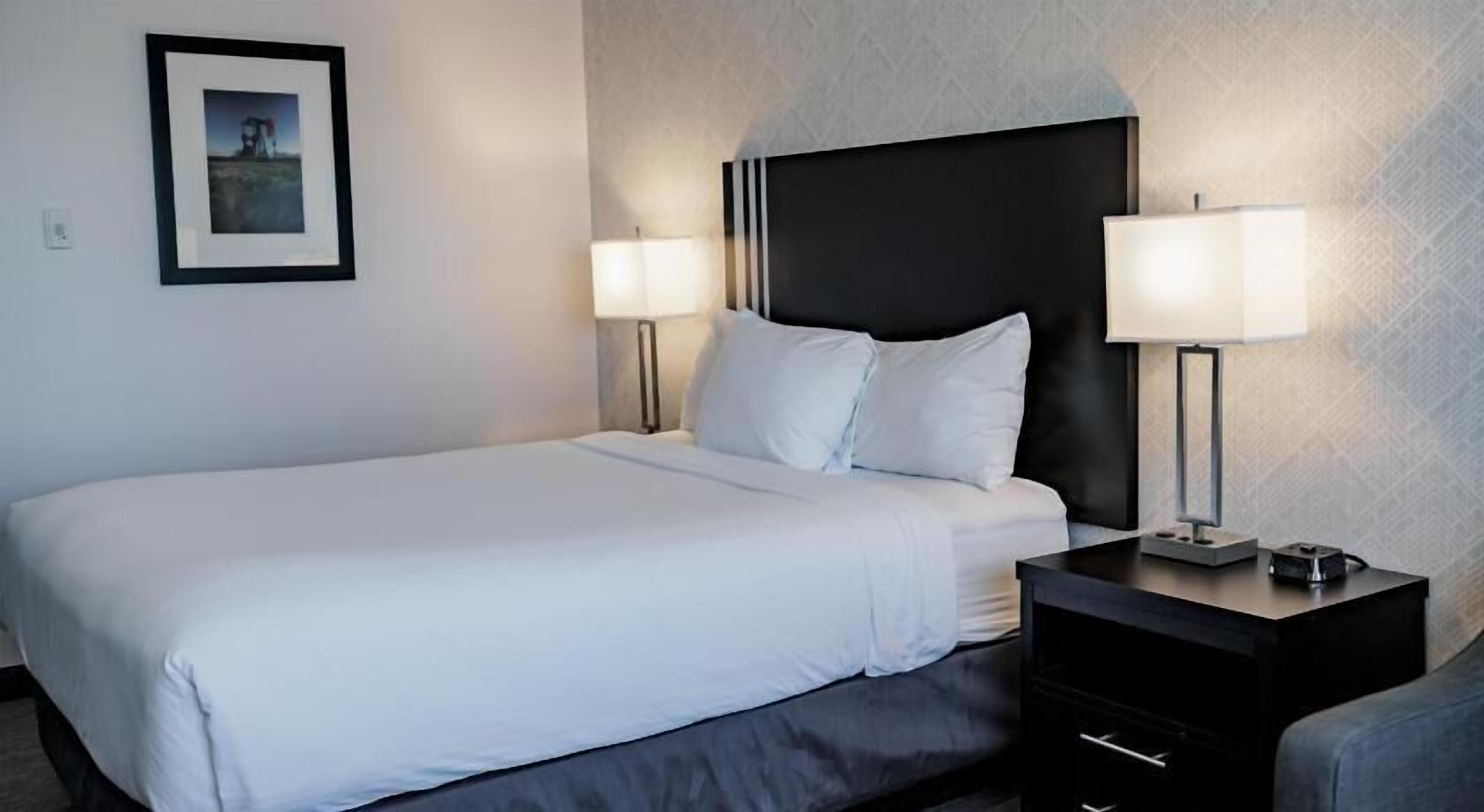 Premium bedding, desk, laptop workspace, soundproofing