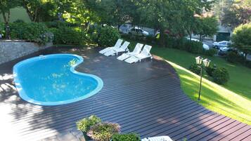 Outdoor pool, pool umbrellas, sun loungers