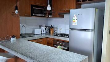 Standard Apartment, 1 Bedroom, Private Bathroom | Private kitchen | Fridge, microwave, oven, stovetop