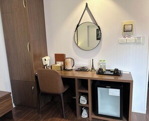Luxe beddengoed, een minibar, een kluis op de kamer, een bureau