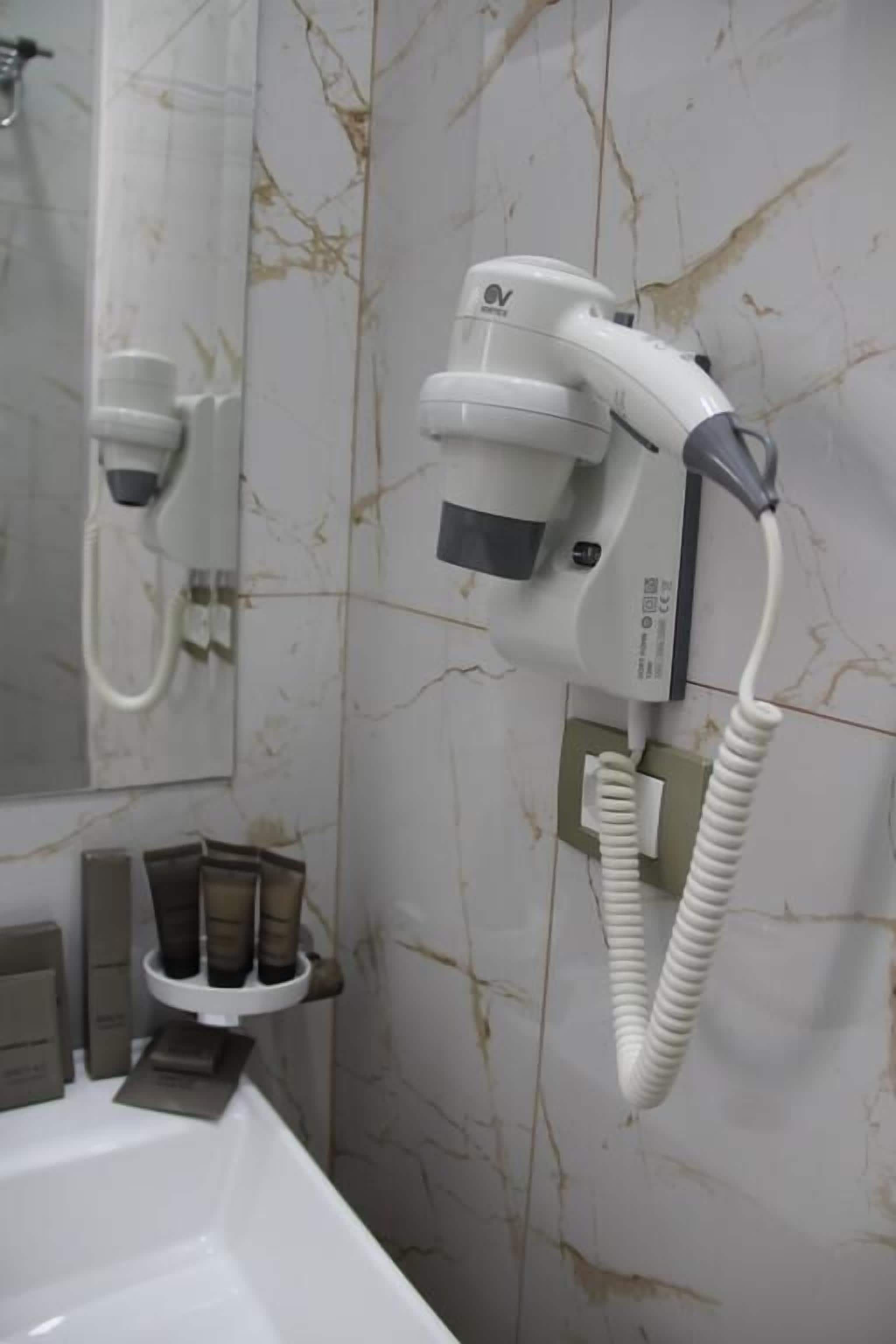 economy double room | bathroom amenities | shower, free toiletries, hair dryer, slippers