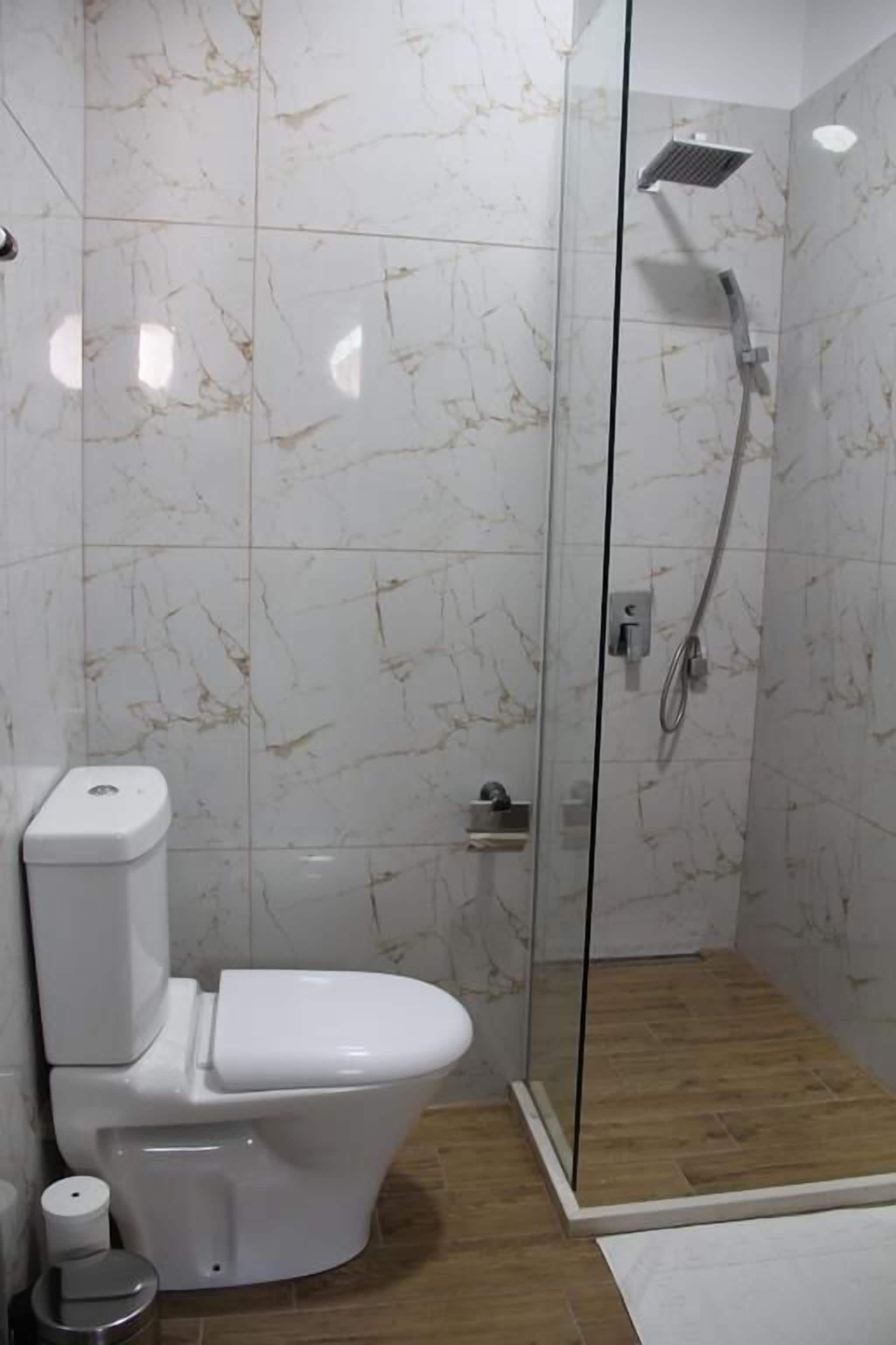 economy single room | bathroom | shower, free toiletries, hair dryer, slippers