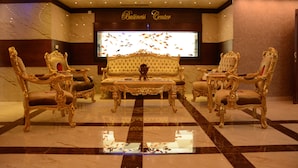 A luxurious lobby with ornate golden chairs, a tufted sofa, and a large television screen. - Rojina Hotel (Amman)