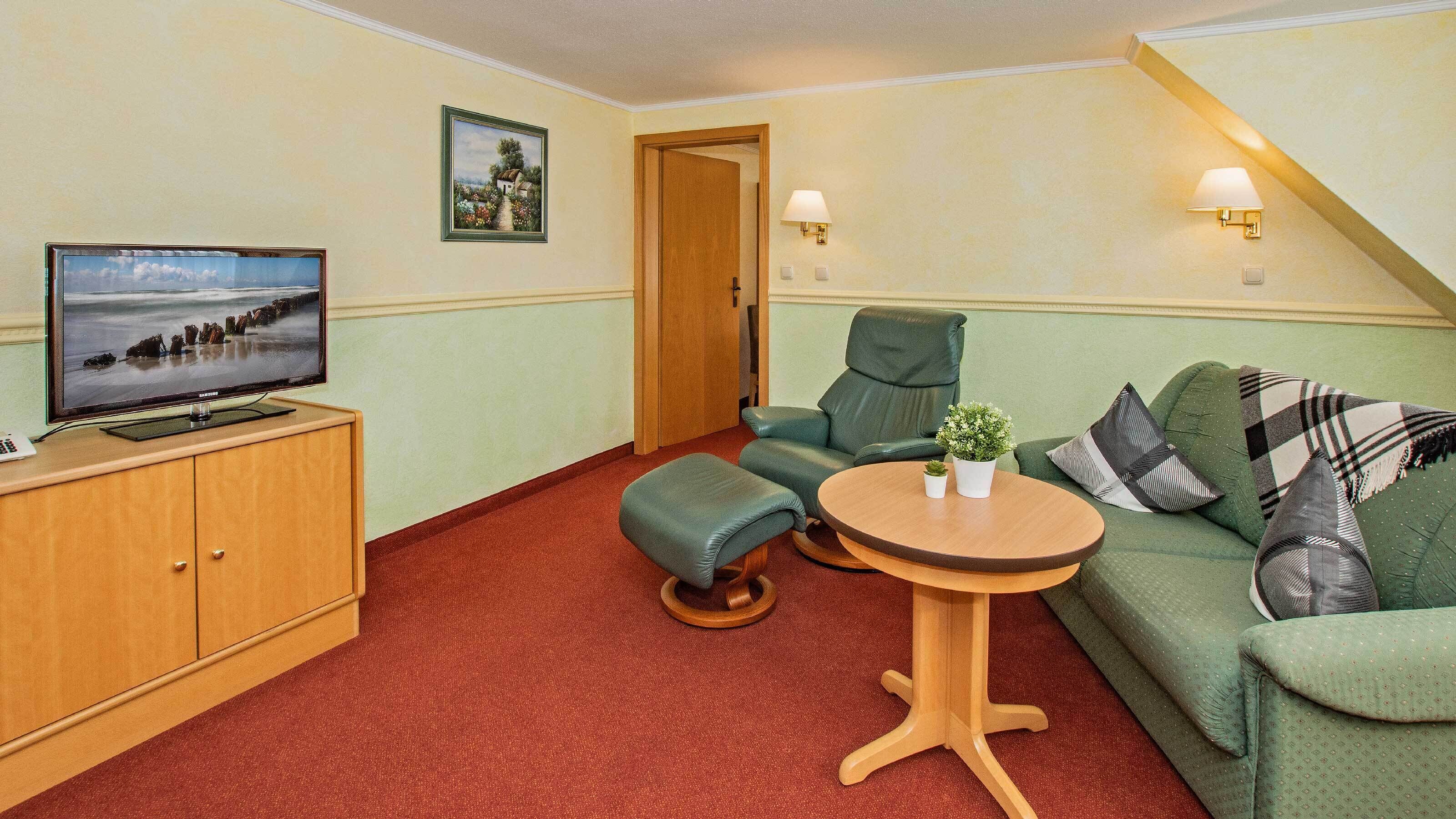 junior suite, 1 bedroom | living area | 32-inch led tv with satellite channels, tv