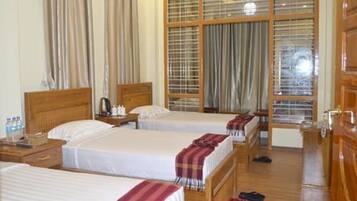 Deluxe Family Room | Minibar, individually furnished, desk, blackout drapes