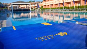 Outdoor pool, pool umbrellas, sun loungers