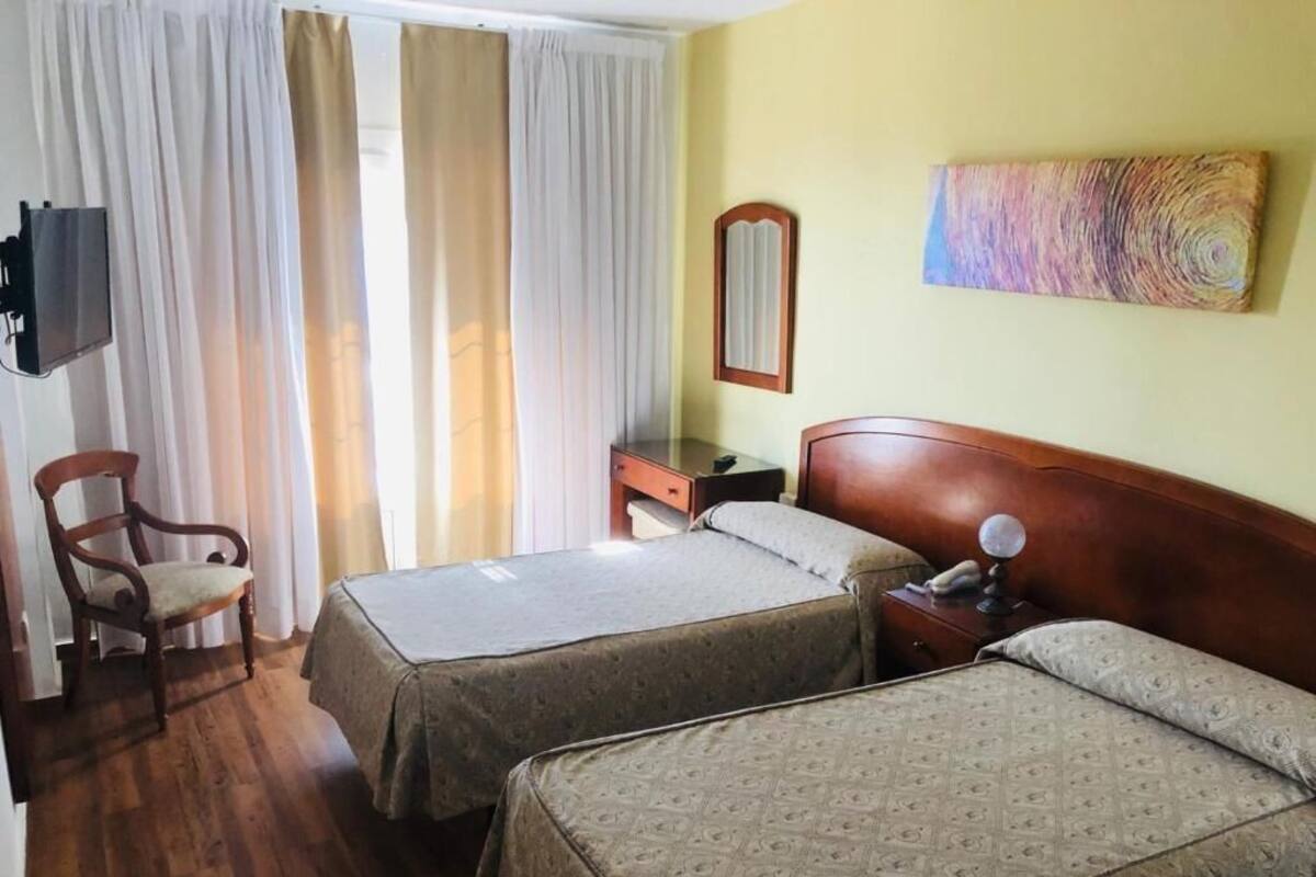 Desk, blackout drapes, iron/ironing board (on request), WiFi (free)