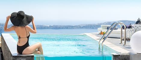 Outdoor pool, open 10 AM to 7 PM, pool umbrellas, sun loungers