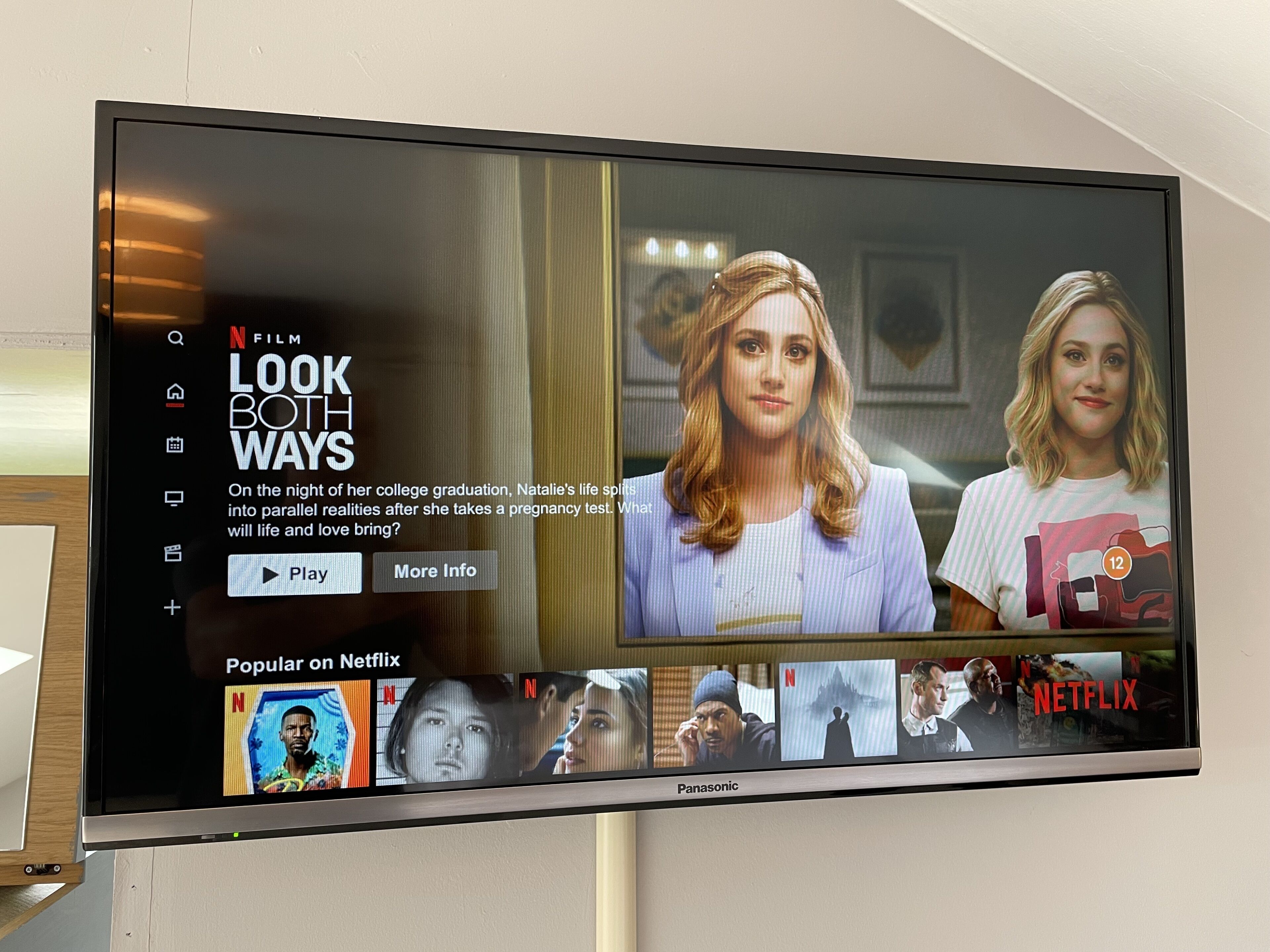 A television screen displaying a Netflix interface with the title "LOOK BOTH WAYS" and a synopsis about a show.