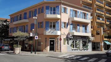 Hotel entrance marked by a sign reading 'HOTEL' with adjacent shop 'Florets Flowers & Design'.