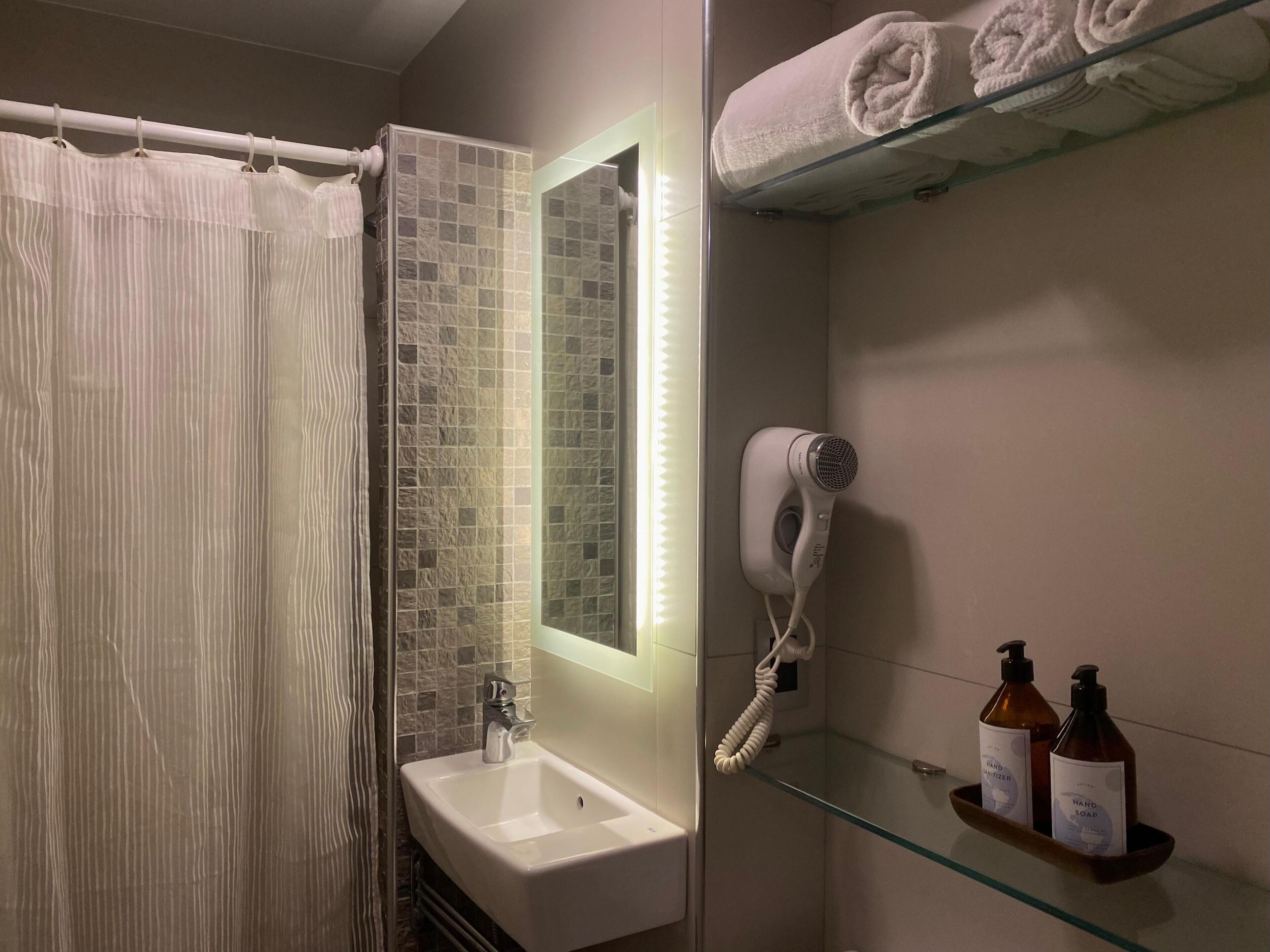 shower, free toiletries, hair dryer, towels