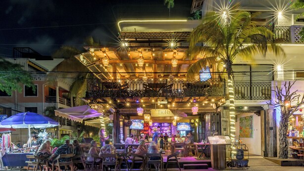 An outdoor dining area with tables and chairs, a covered seating area, and a bar. - Hotel Banana Boutique & Spa by Paradise Hotels - 5th Av Playa del Carmen (Playa del Carmen)
