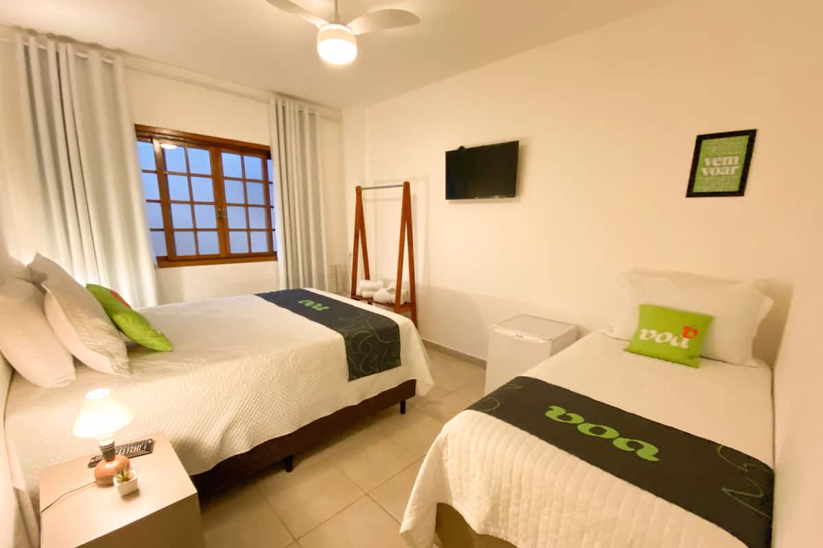 Standard Triple Room | Minibar, in-room safe, iron/ironing board, bed sheets