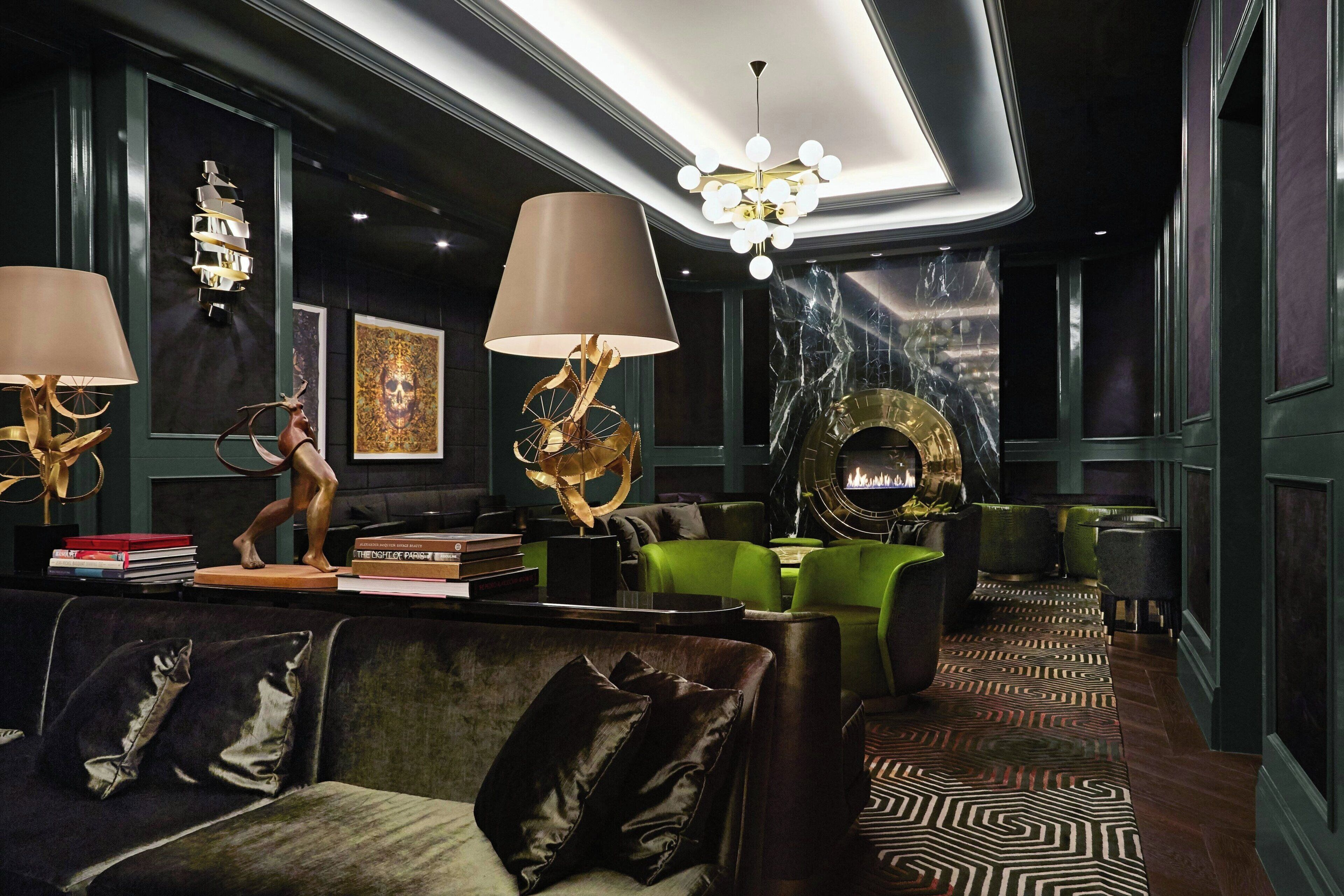 A modern interior with a fireplace, seating area, and decorative lamps.