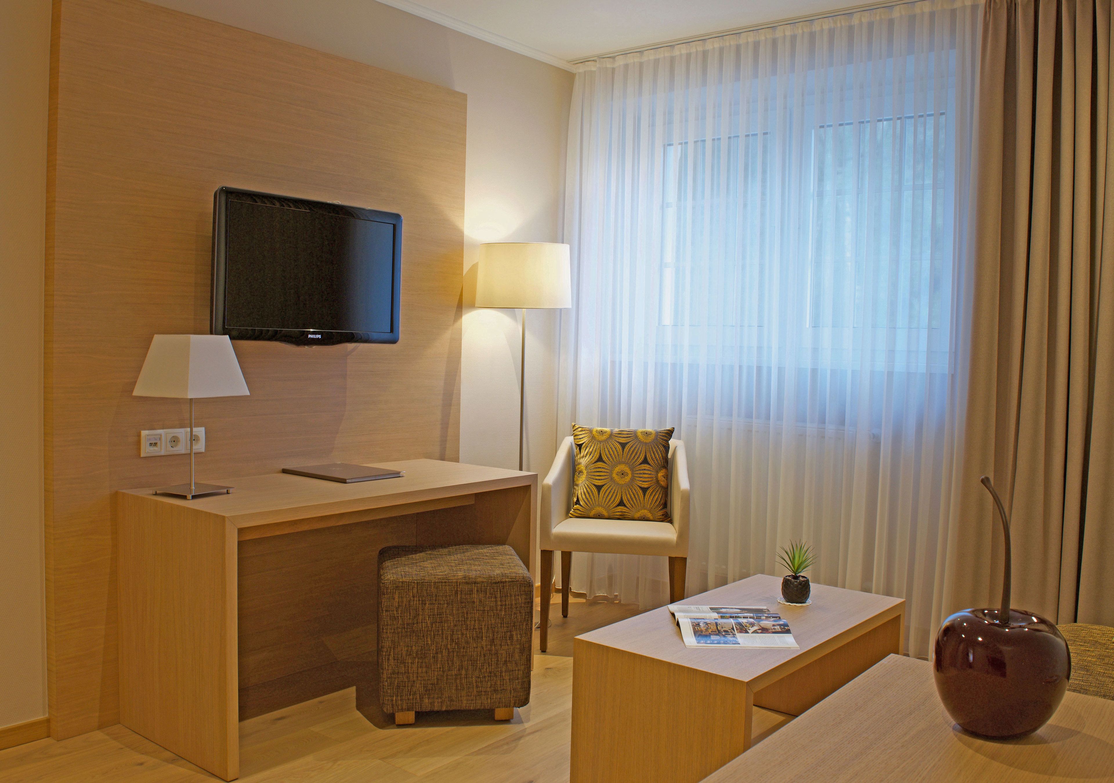 comfort double room, terrace | living area | flat-screen tv