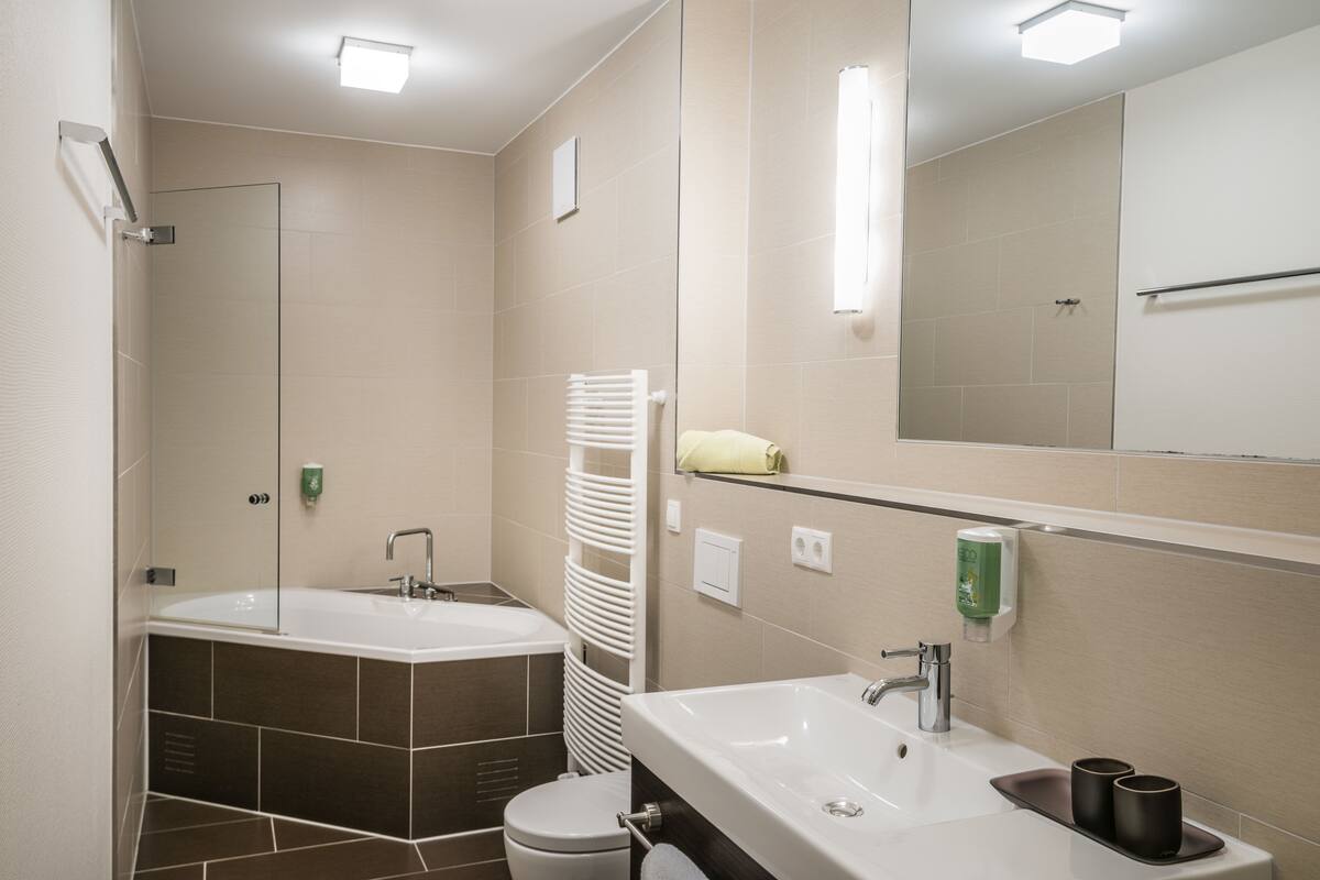 double room, annex building | bathroom | shower, hair dryer, slippers, towels