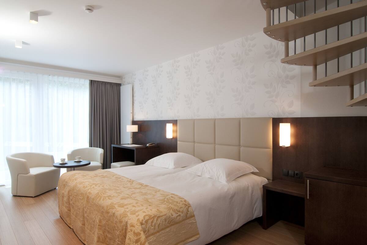 shower, hair dryer, slippers, towels